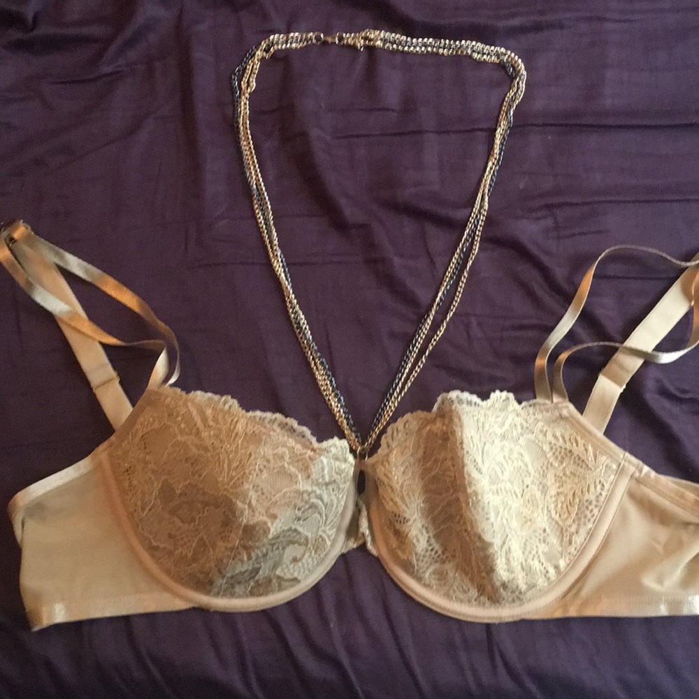 Gold cacique Demi cup bra with attached necklace.